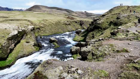Iceland---Immerse-yourself-in-nature's-beauty-as-a-lone-traveler-embarks-on-a-scenic-hike-along-Iceland's-Skoga-River