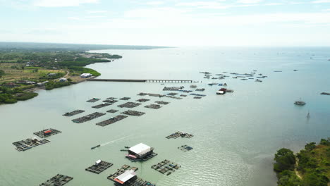 Aerial-view-of-Lobster-farm-cages-in-the-sea,-Gili-Batuputik-Island,-Indonesia