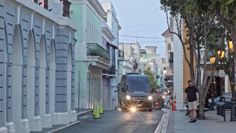 Light-traffic-as-cars-transit-in-Viejo-San-Juan-Puerto-Rico-historical-town-near-Plaza-de-Armas,-during-the-afternoon