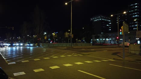 Street-Traffic-Hyperlapse-at-Night,-Cars-Driving,-Pedestrians-in-Hebron-Valley,-Barcelona,-Catalonia-Spain,-Motion-Lapse