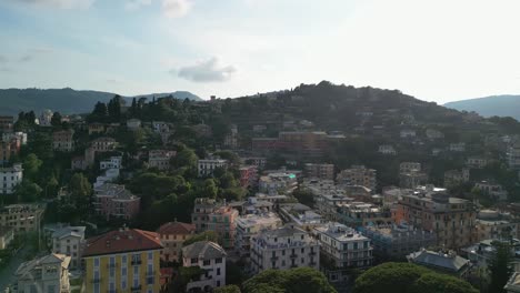 Architecture-of-a-town-Rapallo-in-Liguria-Italy,-from-above,-an-aerial-footage-with-hills-and-houses