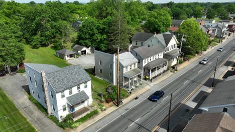 A-drone-rotates-around-shops-and-homes-on-the-main-street-of-Willow-Street,-Pennsylvania