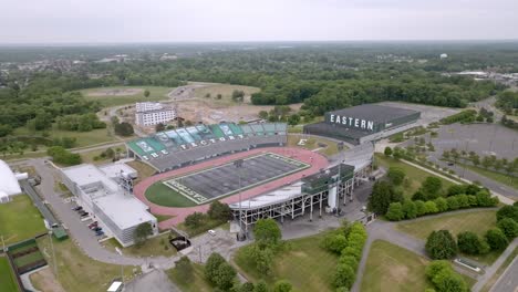 Eastern-Michigan-University-football-stadium-in-Ypsilanti,-Michigan-with-drone-video-moving-in-at-an-angle