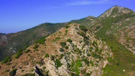 Slanted-peak-of-rock-among-mountain-range-background-in-Turkey