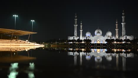 Night-view-of-Abu-Dhabi's-Sheikh-Zayed-Grand-Mosque,-The-mosque-is-one-of-the-world's-largest-and-was-the-vision-of-Sheikh-Zayed-bin-Sultan-Al-Nahyan---the-Founding-Father-of-the-UAE