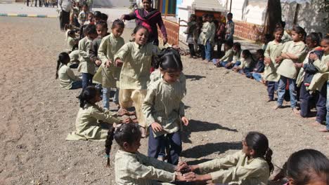 slow-motion-in-which-young-elementary-school-girls-are-playing-a-jumping-game-and-the-game-has-a-lot-of-long-lines