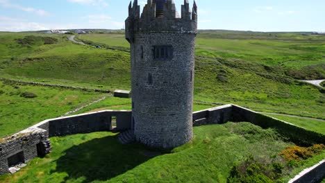Doonagore-stone-Castle-tower-surrounded-by-grass-meadows-in-Clare-County