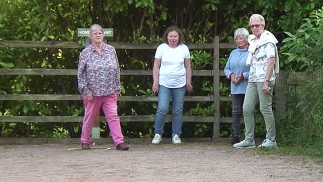 Tossing-the-boules-towards-the-cocoon-during-a-game-of-pétanque-during-a-league-game