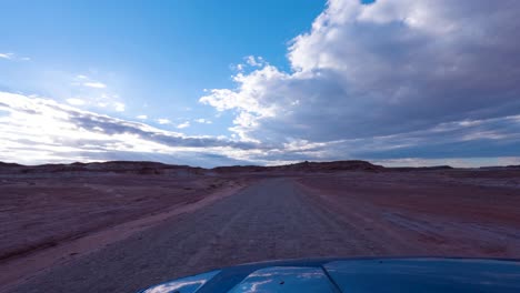 Driving-along-a-dirt-road-in-the-Caineville-Desert-near-Hanksville,-Utah