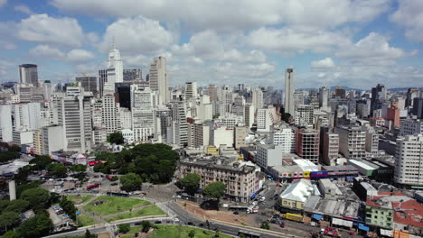 Aerial-view-of-the-skyline-of-Sao-Paulo,-sunny-day-in-Brazil---tracking,-drone-shot