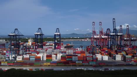 Colorful-shipping-containers-stacked-at-the-Port-of-Manzanillo,-aerial-view