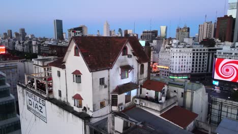 Aerial-view-of-El-Chalecito-Mueblería-Díaz-and-Obelisk-of-Buenos-Aires,-Argentina