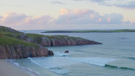 Waves-crashing-inside-a-beautiful-cove-at-dusk-in-the-Scottish-highlands