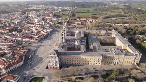 Circling-aerial,-side-view,-Mafra-National-Palace,-Mafra,-Portugal