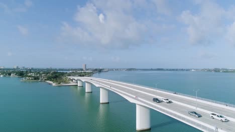 Aerial-Downward-Crane-Approaching-the-John-Ringling-Causeway-Bridge-in-Sarasota-Florida
