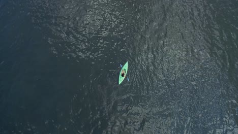 Orbital-Rising-in-Altitude-Bird's-Eye-View-of-Beautiful-Woman-Kayaking