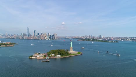 Aerial-Reverse-Dolly-Shot-of-Helicopter-Flyby-Around-Statue-of-Liberty-and-the-New-York-City-Skyline