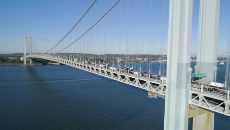 Aerial-Reverse-Crane-Shot-of-Rush-Hour-Traffic-Passing-Over-Verrazzano-Bridge-in-New-York-City