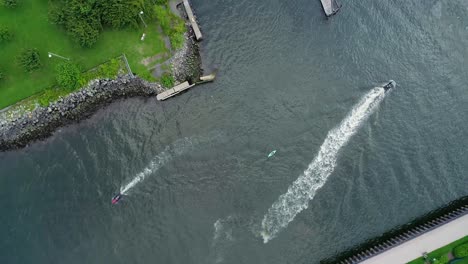 Bird's-Eye-View-of-Woman-Kayaking-in-the-Hudson-River-Surrounded-by-Jet-Skis