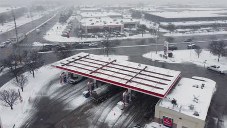 Aerial-drone-shot-of-an-Esso-gas-station-in-the-sowing-winter