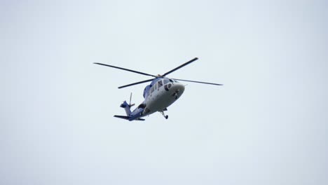 Low-Angle-View-of-Helicopter-Flying-and-Approaching-To-Land
