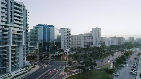 Aerial-Forward-Dolly-in-Downtown-Sarasota-Showing-Morning-Traffic-During-Sunrise