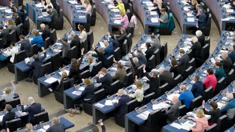 European-Parliament-congress-plenary-hall-with-politicians-voting-in-Strasbourg,-France---Medium-static-shot
