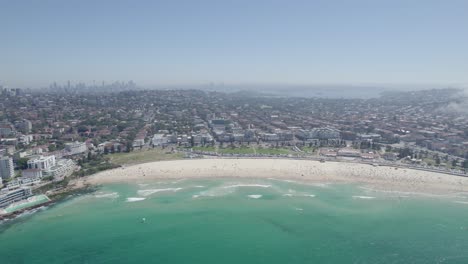 Panorama-Of-Crowded-Bondi-Beach-With-Hazy-Mist-As-Fog-Rolls-Over-Suburb-In-Sydney,-New-South-Wales