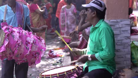 Playing-a-person's-drum-in-a-fair