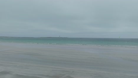 A-lonely-kitesurfer-in-a-bay-on-the-Isle-of-Tiree