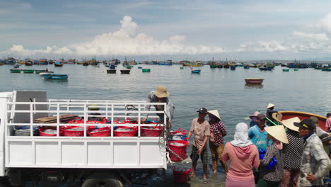Revealing-shot-of-fishermen-community-with-Mui-Ne-beach-in-backdrop