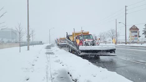 Snowplow-truck,-removes-snow-from-the-road-on-a-snowy-day
