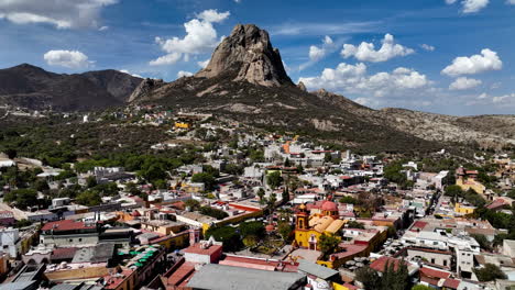Monolith-peak-with-the-Bernal-village-in-the-foreground,-in-Mexico---Aerial-view