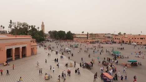 High-angle-panning-view-from-the-city-to-Jemaa-el-Fna-in-Marrakesh,-Morocco