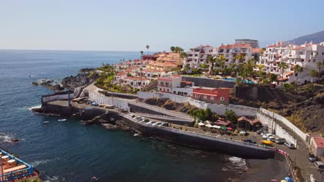 Port-of-Puerto-De-Santiago-in-Tenerife-Island,-aerial-drone,-dolly-in,-day