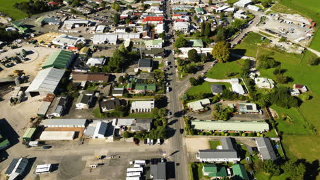 Takaka-small-town-flyover-aerial-view-in-New-Zealand,-Golden-Bay,-day