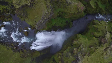 Aerial-overhead-view-of-the-famous-natural-landmark-and-tourist-attraction-of-Skogafoss-falls-in-Iceland
