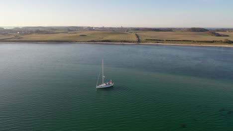 sailing-boat-anchoring-at-coast-in-Denmark