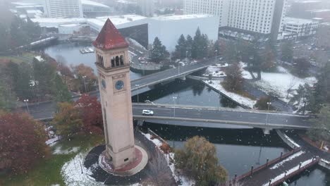 Aerial-view-of-the-Spokane,-Washington-clocktower-with-a-light-dusting-of-snow-falling