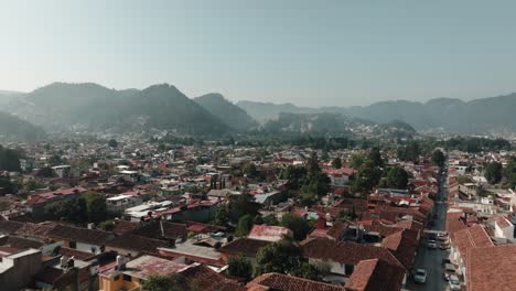 Flying-Over-The-Houses-in-San-Cristobal-de-las-Casas-On-A-Sunny-Day-In-Chiapas,-Mexico