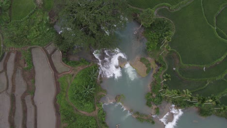Top-down-shot-of-the-famous-Waikelo-Sawah-Waterfall-at-Sumba,-aerial