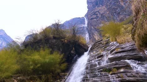 Multiple-tiers-of-cascading-waterfalls-across-sheet-rock-in-himalayas-nepal