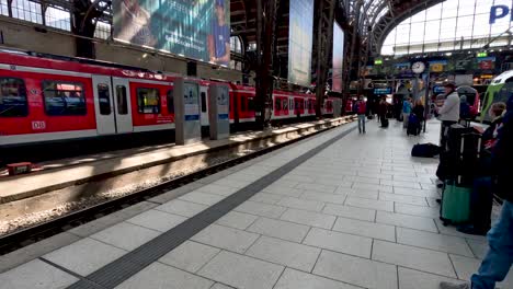 Commuters-Waiting-At-Hamburg-Central-Station-Platform-With-DB-Regio-Regional-Train-On-Opposite-Platform