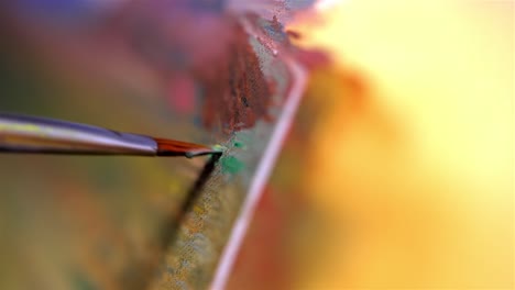 Detailed-closeup-of-fine-tip-paintbrush-spreading-oil-paint