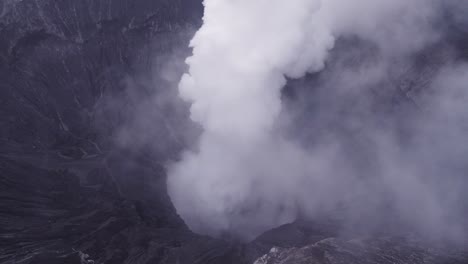 Flying-backward-at-Mount-bromo-active-volcano-east-java,-aerial