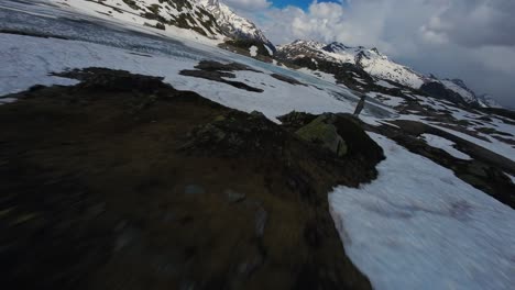 Aerial-fpv-drone-forward-view-over-frozen-surface-of-Totensee-Lake-in-wintertime,-Switzerland