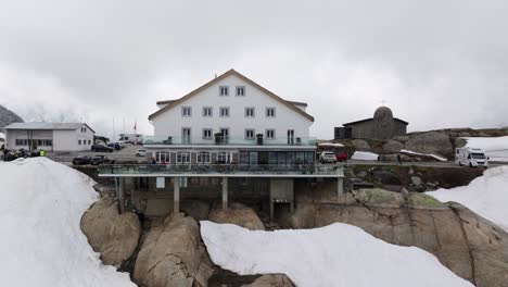 Hotel-Grimsel-Passhöhe-or-Grimselpass-in-Switzerland-seen-from-Totensee-or-Titinsee-Lake
