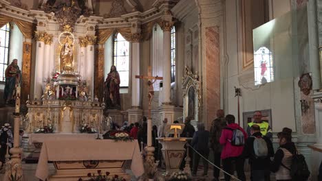 People-in-Franciscan-Church-waiting-to-pray-to-Virgin-Mary,-Csiksomlyo-Pilgrimage