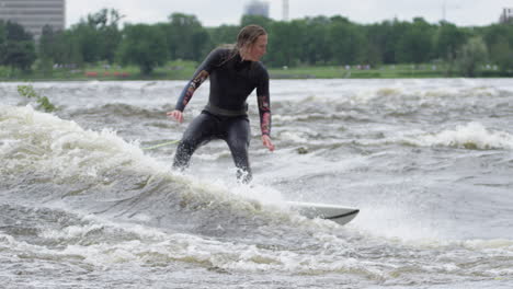 Woman-athlete---Surfing-on-a-river-wave