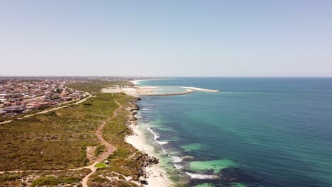 Aerial-footage-of-the-beach,-sea-and-beyond-at-Ocean-Reef,-Australia